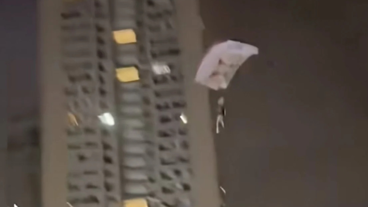 Chinese Man Detained After Illegally Parachuting from Residential Tower for Social Media Attention
