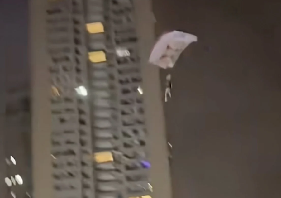 Chinese Man Detained After Illegally Parachuting from Residential Tower for Social Media Attention