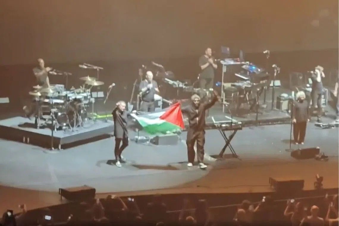 Massive Attack barred from Singapore over Palestinian flag display at concert