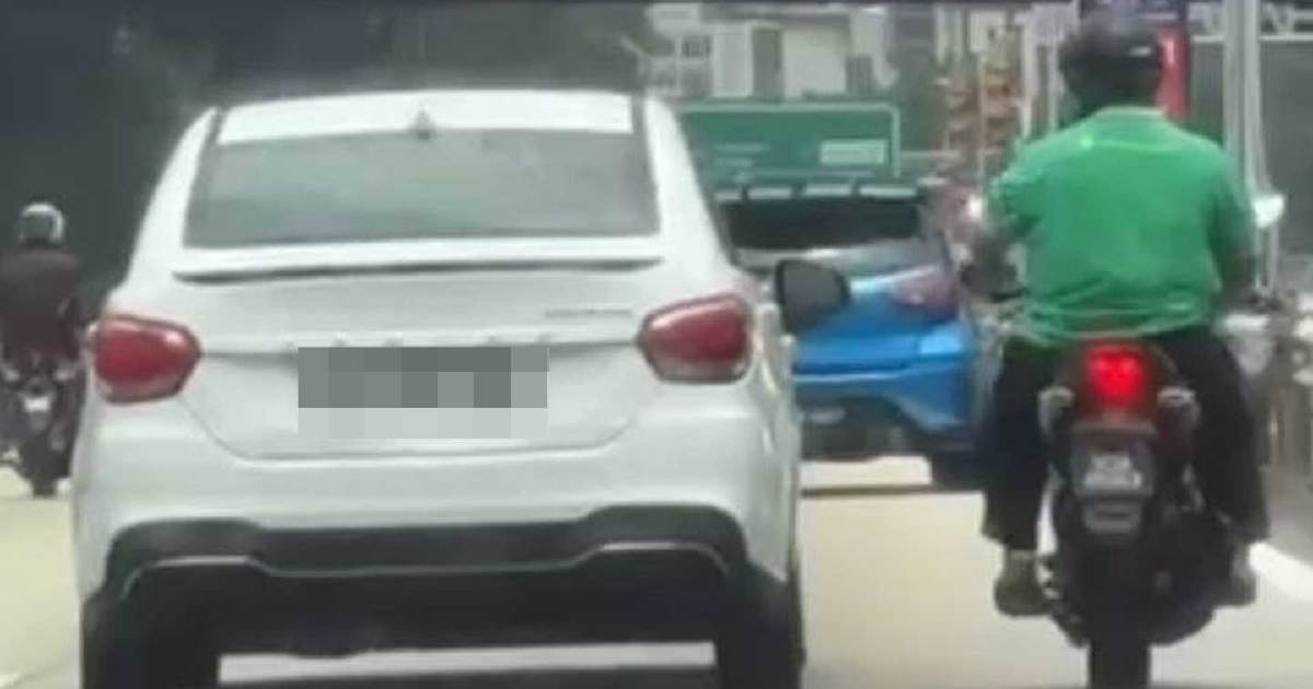 Man arrested after stone thrown at car during highway row