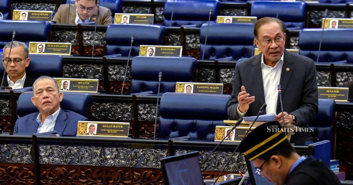 E-wallet Issuers Must Fully Compensate Scam Victims if Security Fails, Anwar Says