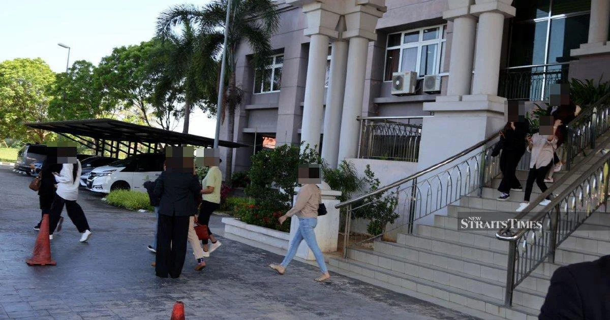 Kelantan Syariah Court Delays Trial of 14 Men Accused of Cross-Dressing