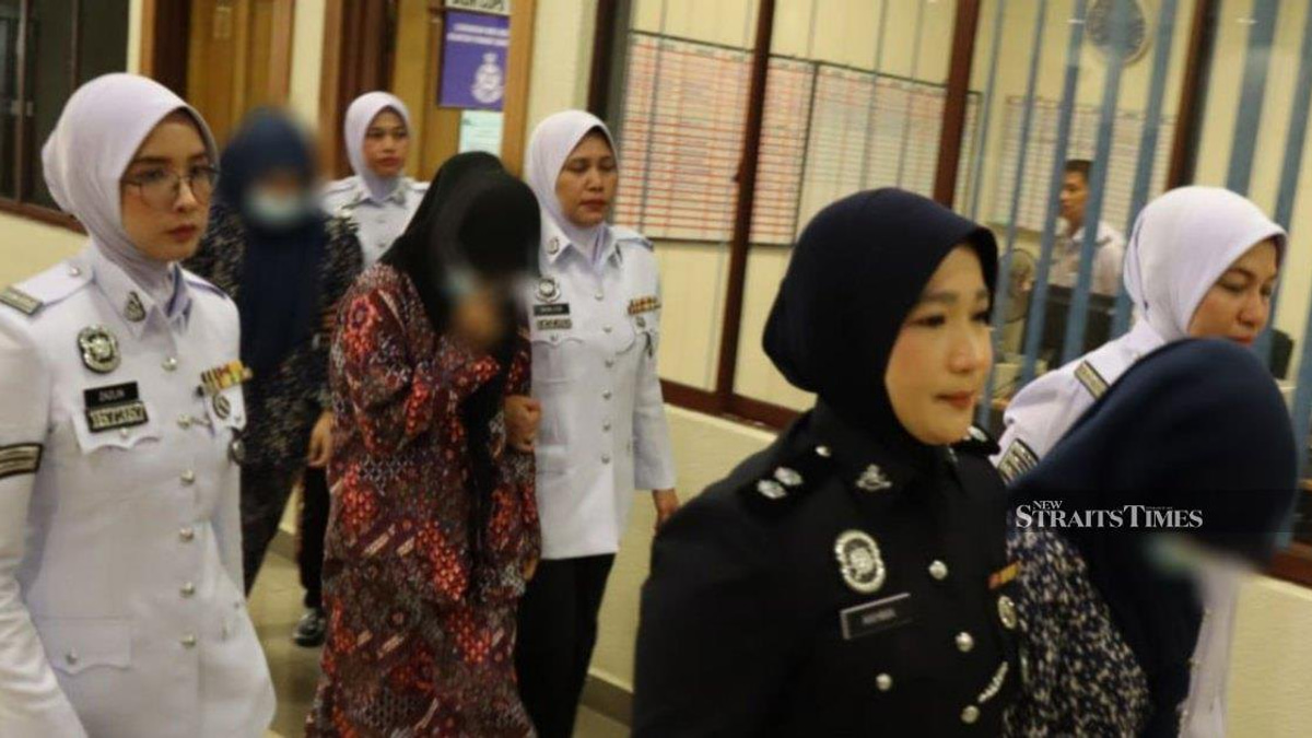 Three women charged over dangerous motorcycle 'Superman' stunt in Kuantan